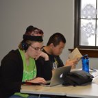 Students working together at a laptop