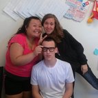 Three Kornerstone students and staff smiling together